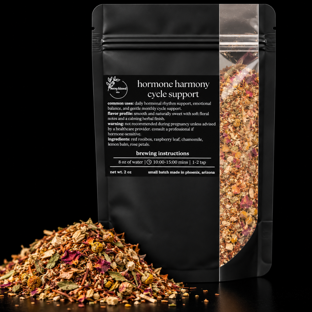 Berry Kissed Bliss Hormone Harmony loose leaf herbal tea made with red rooibos, raspberry leaf, chamomile, lemon balm, and rose petals.